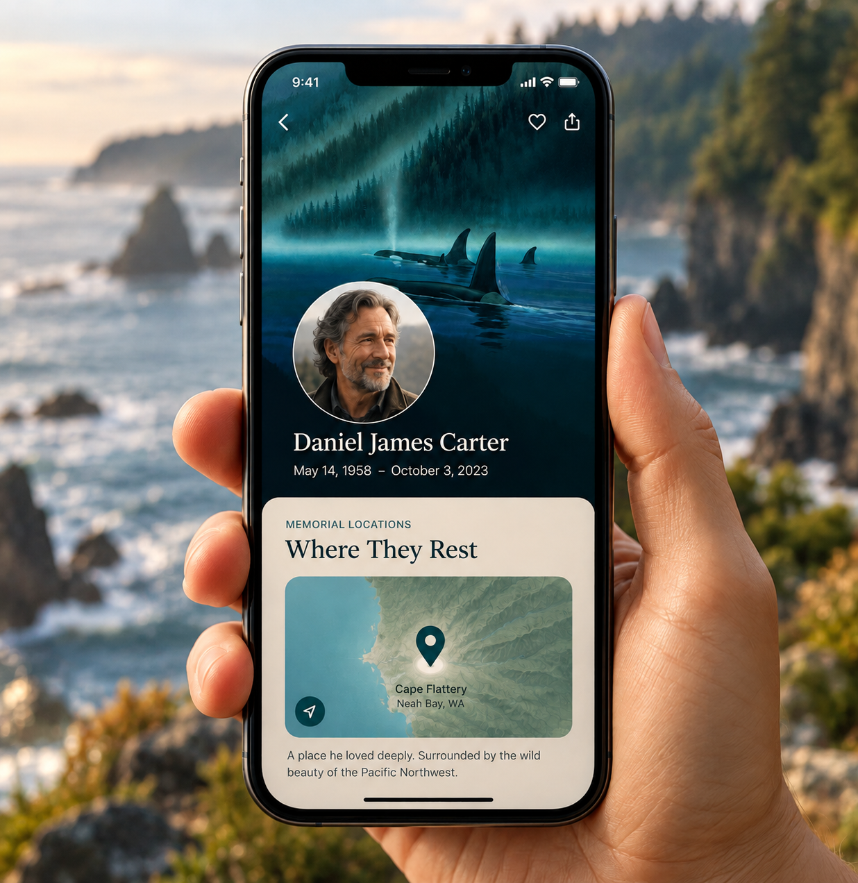 A hand holding a phone showing a memorial profile with the person's portrait and the Where They Rest location card on a map of the Pacific Northwest coast